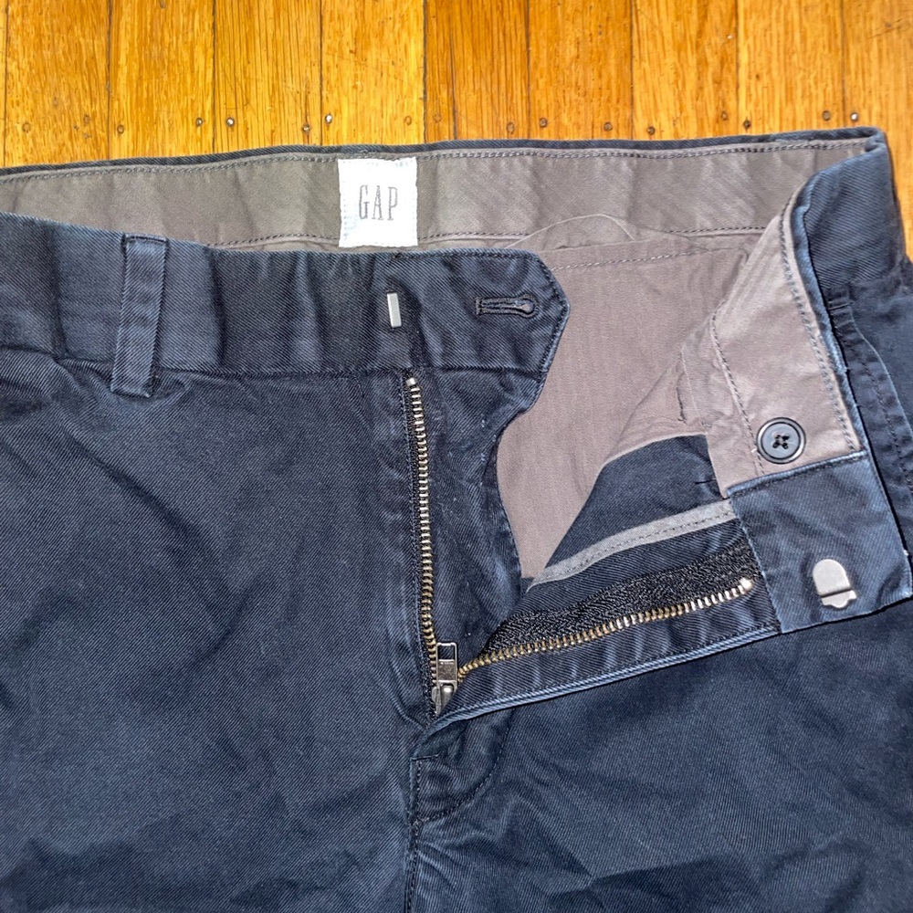 Black straight leg trousers.